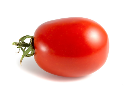 Oblong tomato isolated on white background.