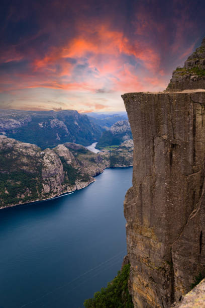 Colorful sunset of the Lysefjord in Norway. View from the Preikestolen The Lysefjord in Norway with a colorful sunset. View from the Preikestolen ryfylke stock pictures, royalty-free photos & images