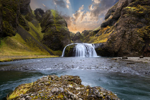 colorful sunset at a waterfall in iceland - gullfoss falls imagens e fotografias de stock
