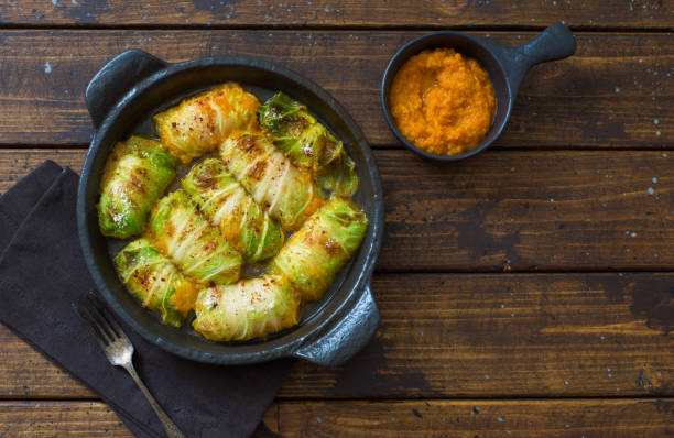 Cabbage rolls stuffing with rice and vegetables serving in black cooking tray stock photo