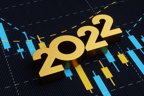 concetto di investimento e finanza - 2022 seduto sullo sfondo del grafico finanziario - stock exchange stock market data finance financial figures foto e immagini stock