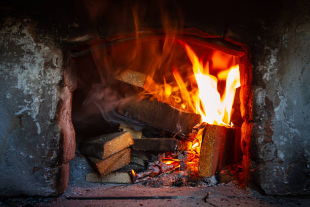 istock burning wood in the old fireplace 1350371581