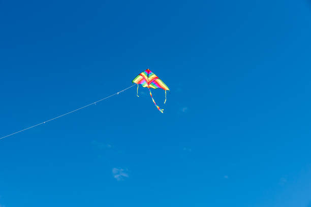 istock Colorful Kites flying over the sky 1350371616