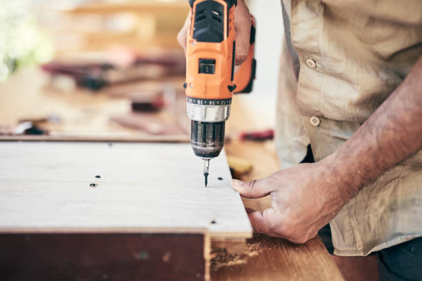 istock Man assembling furniture and fixing it - hobby concept. 1350372714