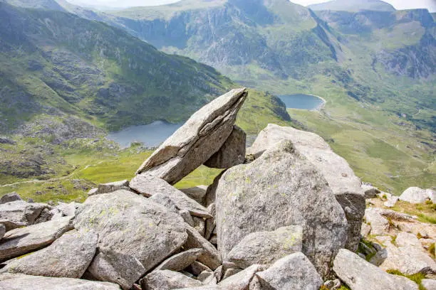 View from Tryfan of Ogwen Valley, Snowdonia, Wales, with rock formation in the foreground