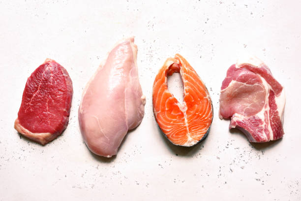 istock Different types of organic raw meat : beef, chicken, fish and pork 1350379111