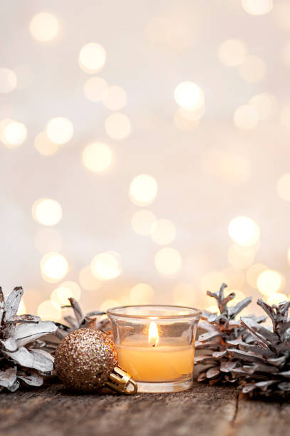 istock Christmas festive background from Christmas tree decorations and burning candles. Vertical photo 1350379171