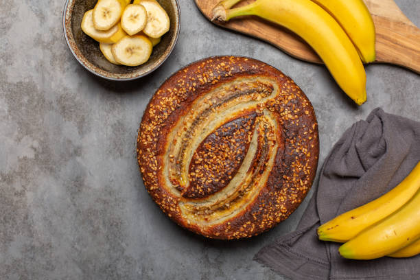 istock Banana bread, fresh bananas. Grey background, copy space. 1350379440