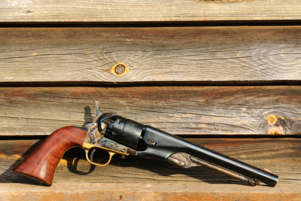 istock Black powder revolver on an old board 1350380143