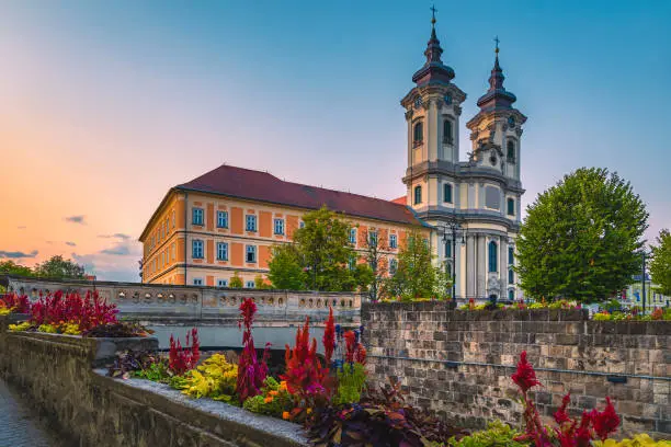 Photo of Catholic church view from the waterfront at dawn, Eger, Hungary