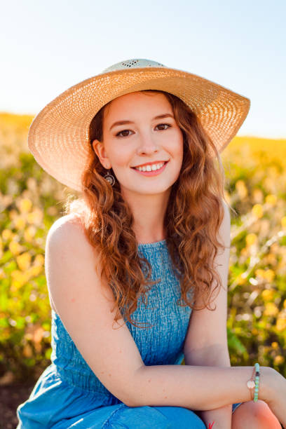 Girl in a yellow flower field stock photo