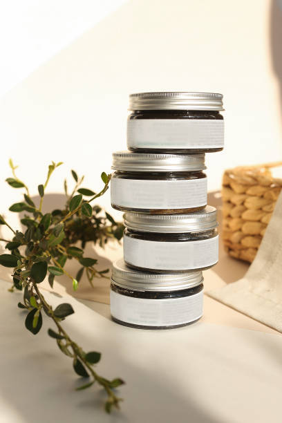 istock plastic jar with cream and lid isolated on neutral light background. Beauty spa and taking care of skin product 1350384281