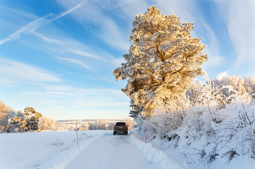 Falköping, Sweden - January 15, 2017: Car on a winter road with snow in the countryside