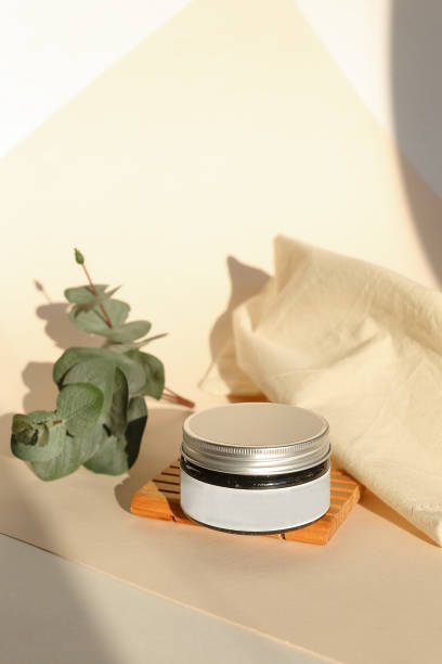 istock plastic jar with cream and lid isolated on neutral light background. Beauty spa and taking care of skin product 1350385222