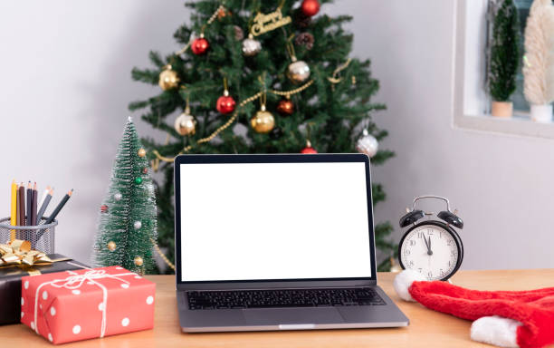 istock Mock up laptop computer with white screen on office table.  Home office desk workspace. Mock up copy space. 1350387632