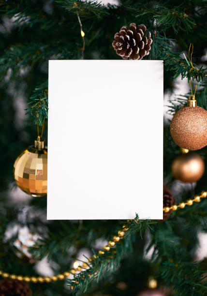 istock mockup christmas greeting card for invitation design on christmas tree background. 1350387649
