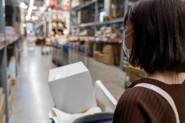 istock Young Asian woman shopping at warehouse 1350387761