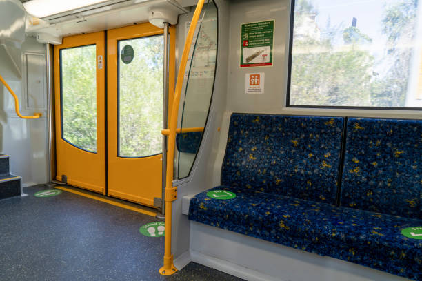 istock Sydney train carriage with stickers sit hear and stand here for social distancing during Covid-19 pandemic. 1350389025