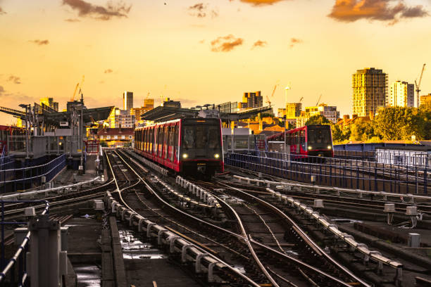 an underground train in motion - canary wharf railway station imagens e fotografias de stock