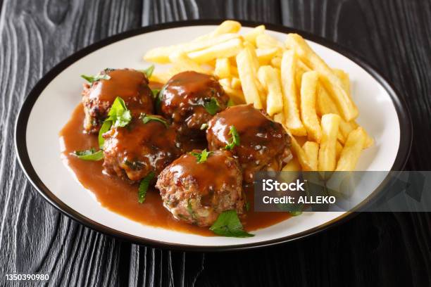 Belgian Boulets Sauce Lapin Meatballs In Apple Gravy And French Fries Closeup In The Plate Horizontal Stock Photo - Download Image Now
