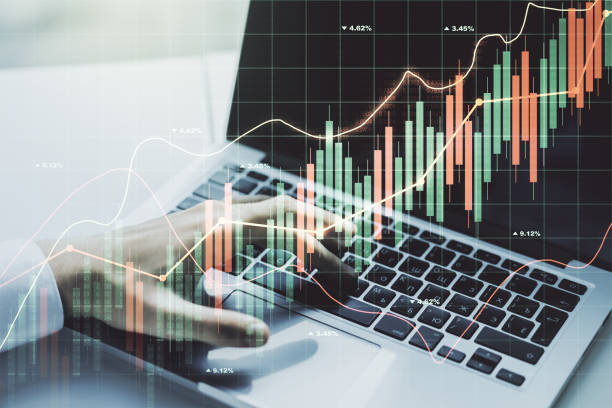 istock Double exposure of abstract creative financial diagram with hand typing on computer keyboard on background, banking and accounting concept 1350397950