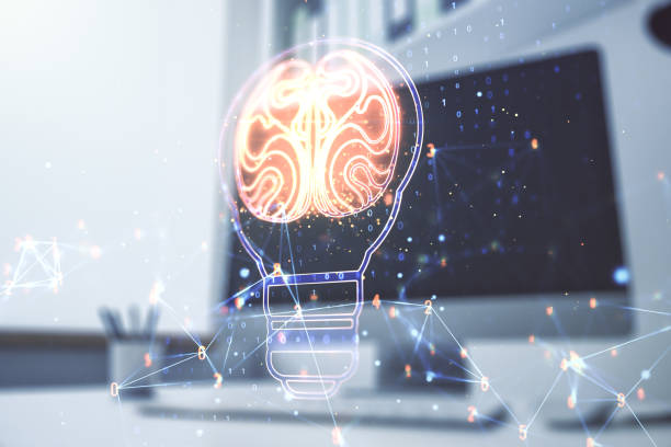istock Creative light bulb illustration with human brain and modern desktop with pc on background, future technology concept. Multiexposure 1350398028