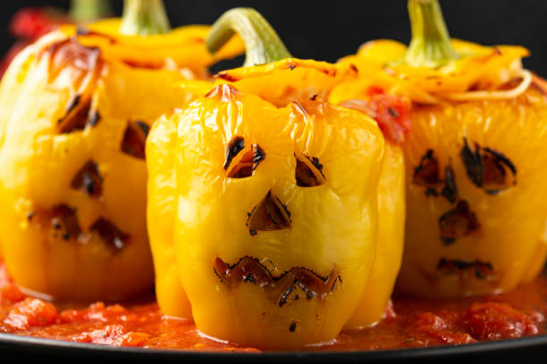 istock Jack o lanterns stuffed yellow pepper for Halloween. 1350403896