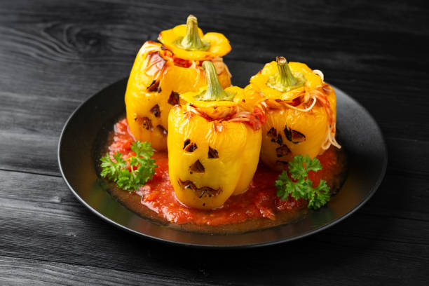 istock Jack o lanterns stuffed yellow pepper for Halloween. 1350403901
