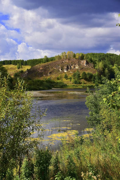 Rock outcrop Kamen Lobach Rock outcrop Kamen Lobach on the right slope of the Sylva river valley. Tourist site in the Kishert district of the Perm region. big blue crane stock pictures, royalty-free photos & images