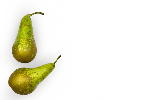 Two whole pears isolated on a white background. Top view.