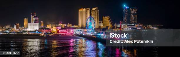 Panoramic Aerial View Of The Broadwalk On The Waterfront In Atlantic City Downtown The Famous Gambling Center Of The East Coast Usa With Multiple Casinos And Amusing Park With A Ferris Wheel On A Pier Stock Photo - Download Image Now