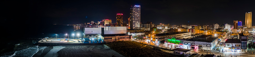 Night view of the Broadwalk along the Downtown Atlantic City's waterfront, New Jersey, USA. Extra-large high-resolution aerial stitched panorama.