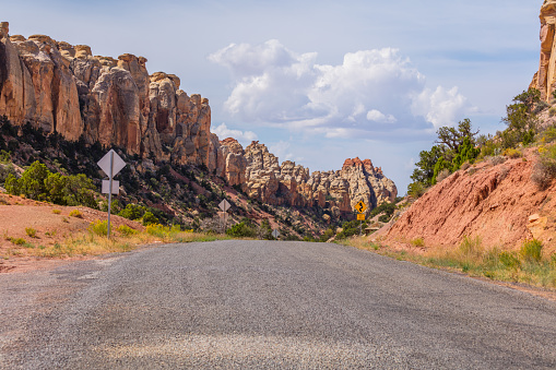 Road to the canyon. Amazing rock landscape. Orange rock slopes. Scenic view of the canyon. Beautiful view of the Burr trail road, Utah, USA
