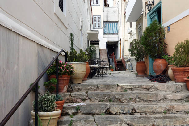 istock Narrow street with pots 1350415215