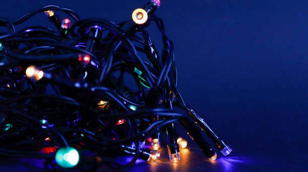 istock Christmas lights bundle close-up view on black background 1350416137