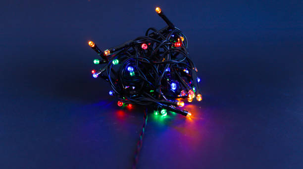istock Christmas lights bundle close-up view on black background 1350416142