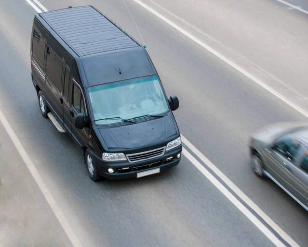 istock The minibus goes on a suburban highway 1350417636