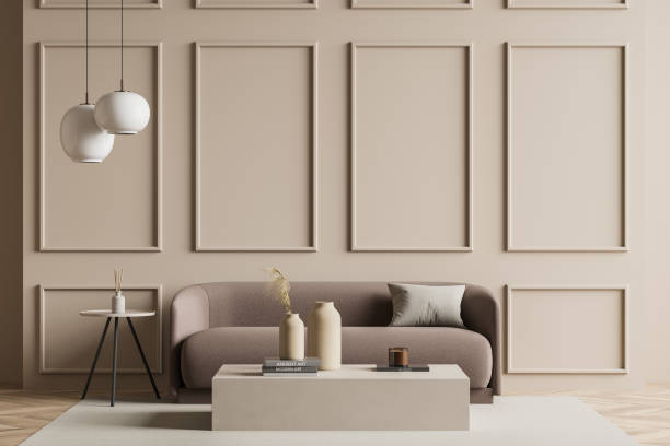 Seating area with a sofa next to a beige living room wall