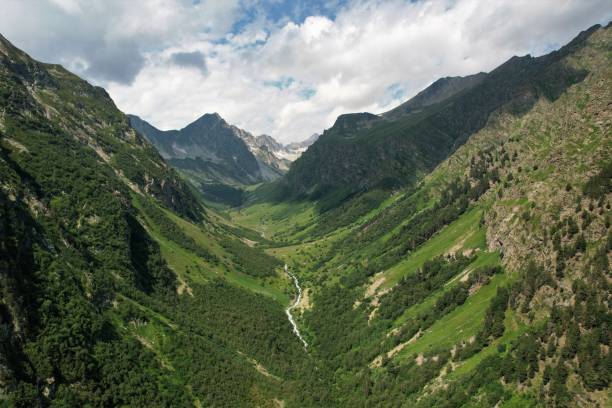 istock Green mountain valley view from above on a cloudy summer day 1350425538