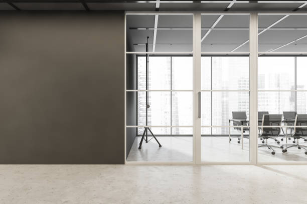 istock Empty grey wall with meeting room glass door 1350425570