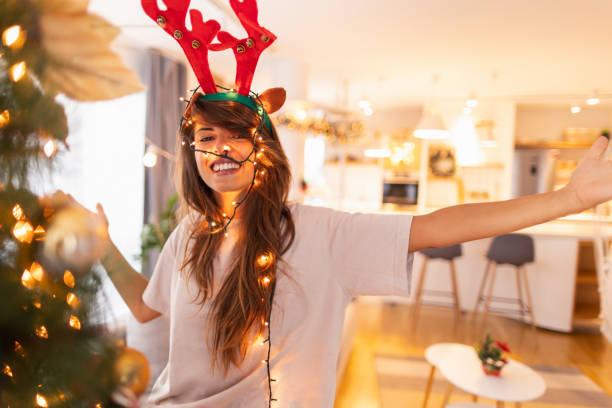 istock Woman decorating home for Christmas 1350427396