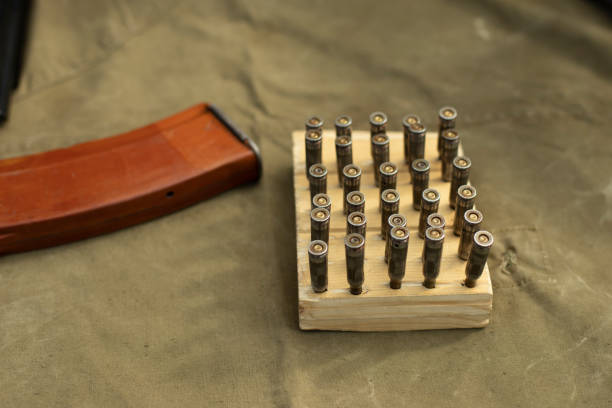 istock Cartridges from firearms. Cartridges on the training stand. Soviet automatic weapons in detail. 1350429466