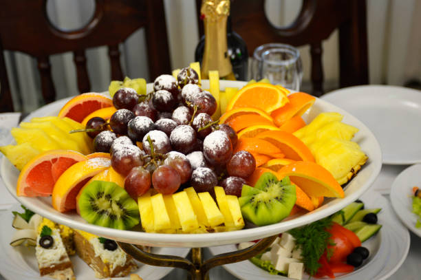 istock Fruit platter of fresh grapes, orange, pineapple, kiwi, mango and grapefruit 1350430900