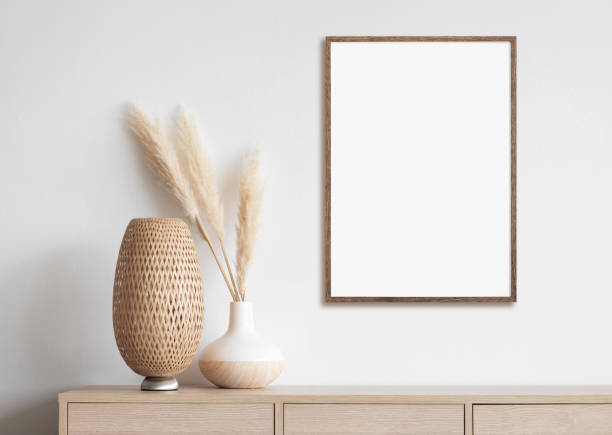 istock Artwork mock-up in interior design. Blank white picture frame on a white wall 1350431020