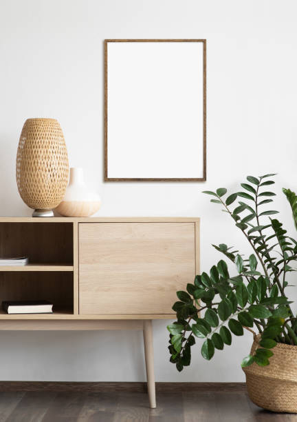 istock Artwork mock-ups in interior design. Blank white picture frames on a wall 1350431021