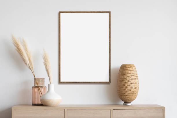 istock Artwork mock-up in interior design. Blank white picture frame on a white wall 1350431050
