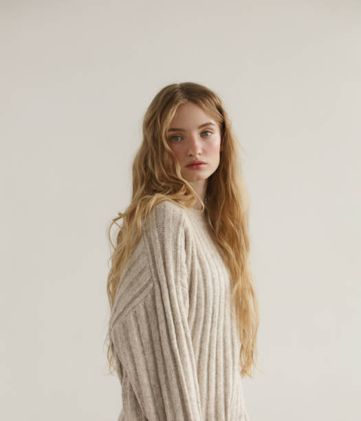 istock Young beautiful woman wearing beige sweater 1350431068