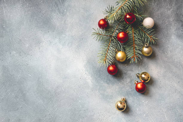 istock Christmas background with copy space. Christmas tree branches decorated with Christmas decorations. Top view. 1350431876