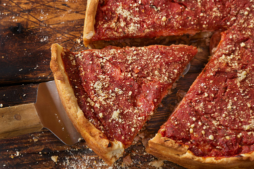 Deep Dish Chicago Style Pizza Pie with Italian Sausage, Pepperoni, Mozzarella with a Crushed Tomato Sauce