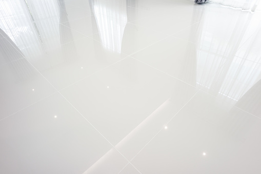 istock White tile floor in perspective view for background. 1350432357